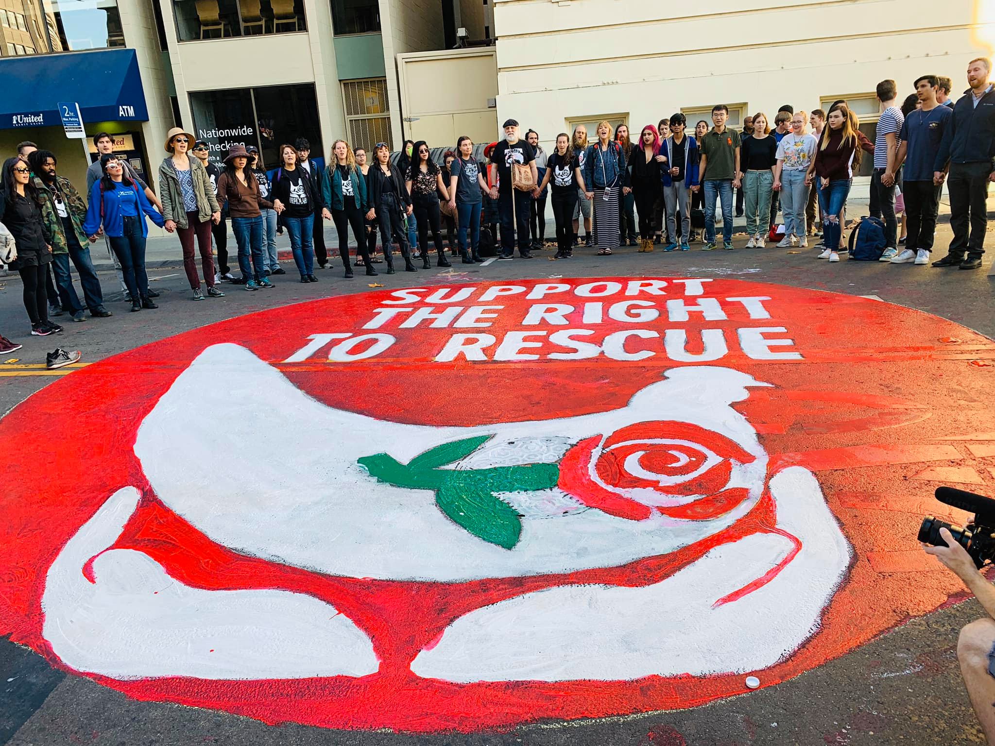 Activists Paint Giant Street Mural In Front Of City Hall