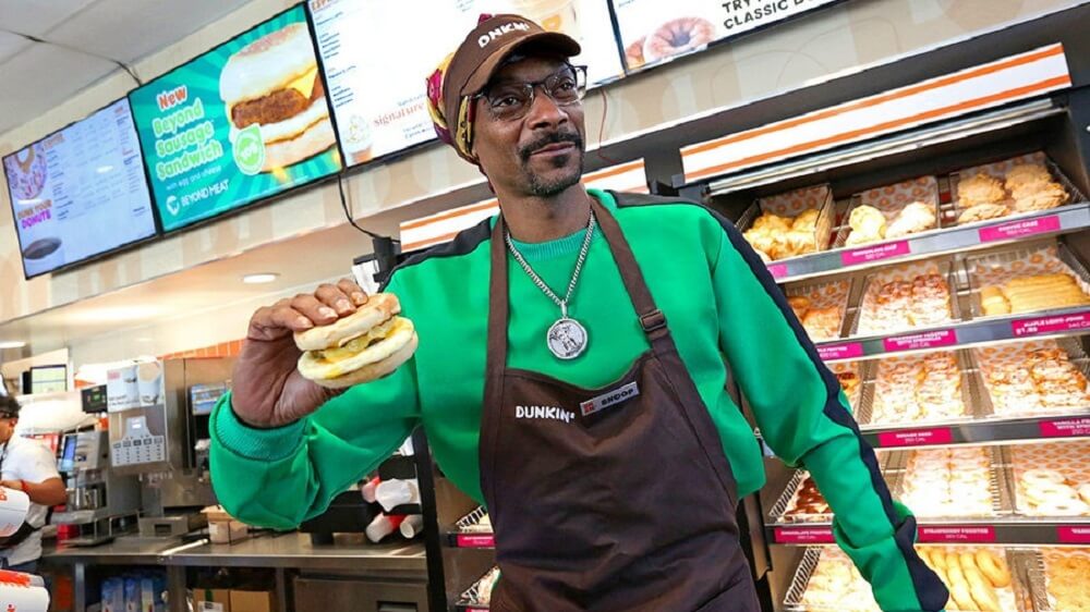Snoop Doggs latest Dunkin' commercial has him serving Beyond Meat Beyond Sausage Breakfast sandwiches